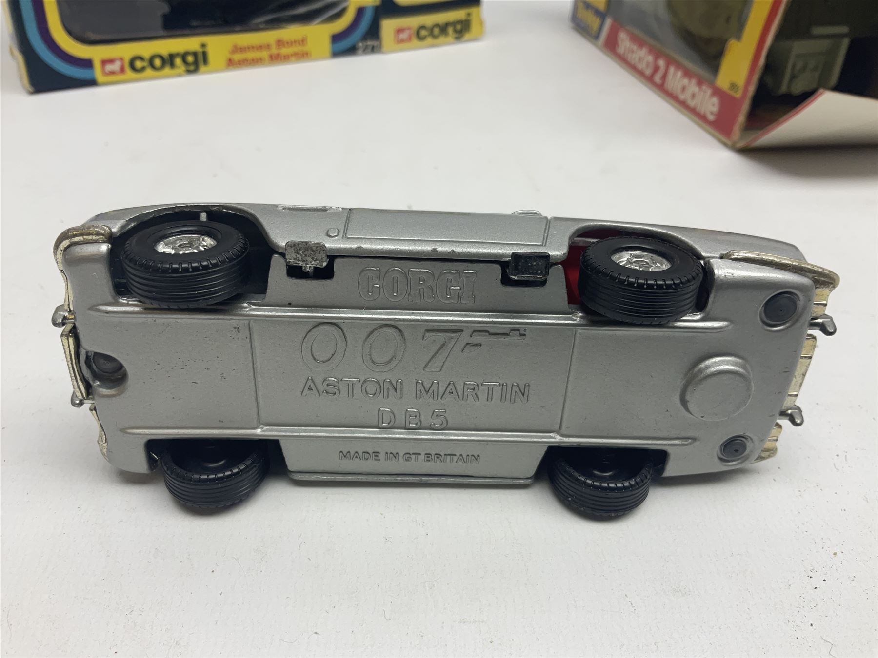 Corgi - die-cast model of James Bond Aston Martin DB5 No.271 with silver body and red interior, gold bumpers and four-spoke wheels, James Bond and two bandit figures; original window box with header card; and Dinky Shado 2 Mobile with one missile No.353; in window box (2)