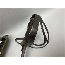 George V British Army 1897 pattern officers sword with plain 82cm fullered steel blade, pierced  basket hilt with George V cypher and wire bound leather grip with chequered backstrap; in leather covered field service scabbard L101cm overall; and another officer's sword in relic condition lacking scabbard (2)