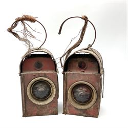 Pair of mid 20th century Kenyons red painted parafin road warning lamps, H42cm.
