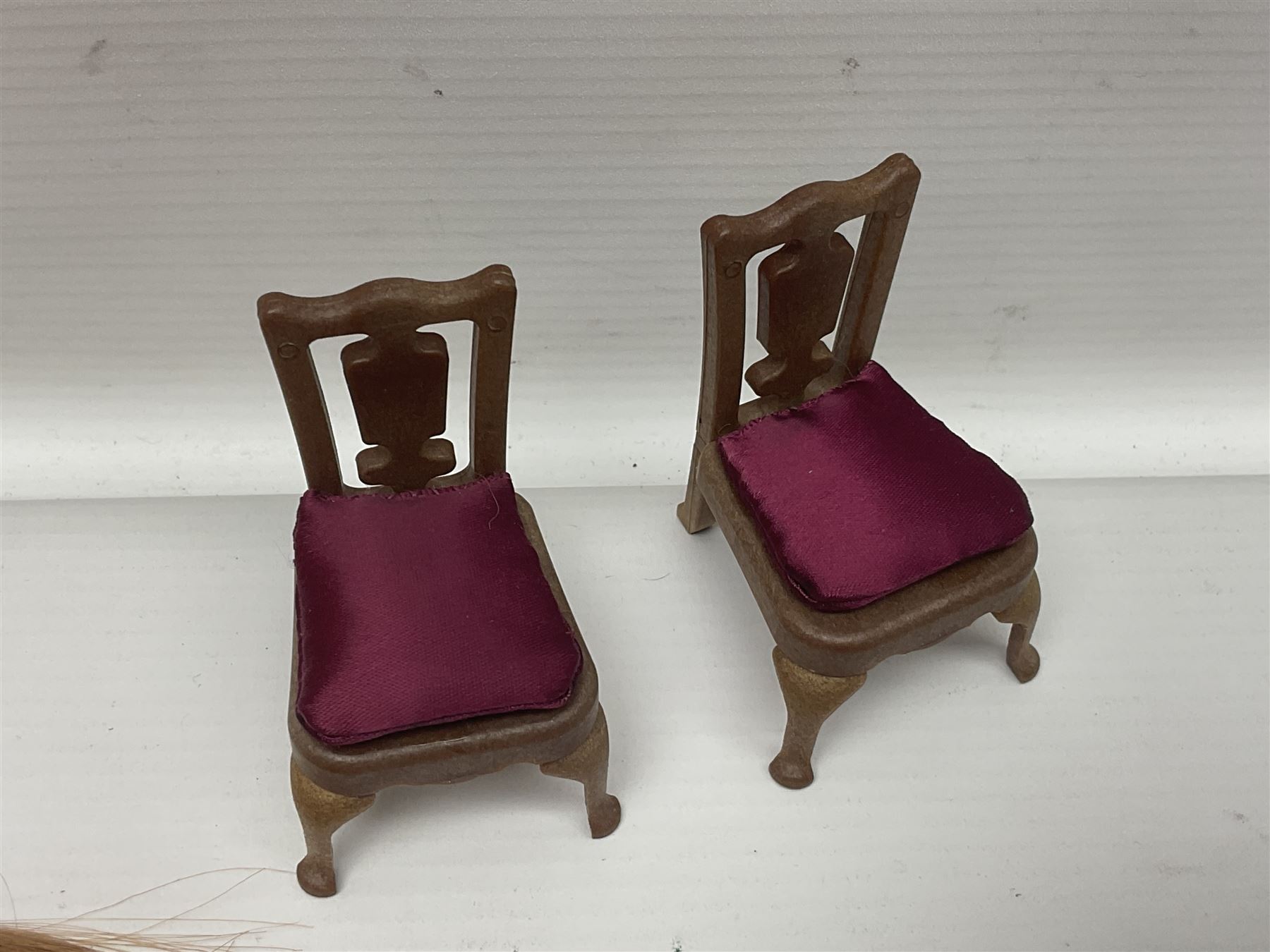 Seven Pippa dolls and a collection of plastic dolls house furniture