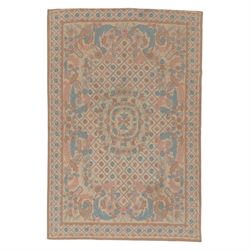Aubusson design pale peach ground rug, woven with an all-over lattice design in rose and c...