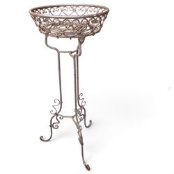 Three wrought iron garden basket planters, comprising a circular pierced and scrolling basket on tall tripod stand with scrolling supports (W31cm H76cm), and a pair of matching hanging baskets (W37cm H30cm)