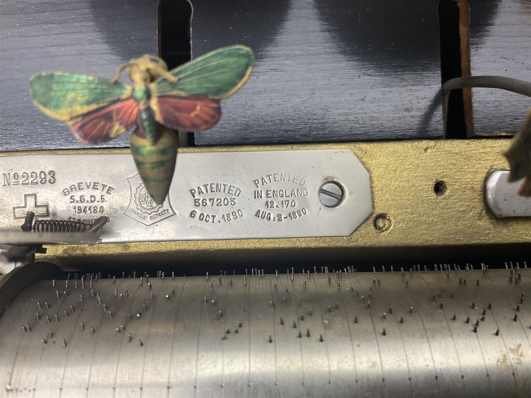 Swiss - 19th-century cylinder music box with three butterfly bells in sight, in a mahogany case with two separately boxed  6” cylinders, glazed viewing lid, 41 tooth comb (one tooth broken) crank key missing, movement untested.