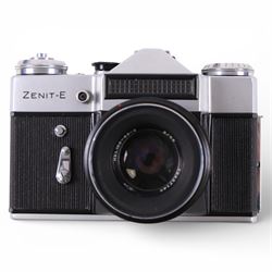 Asahi Pentax Spotmatic 35mm SLR camera, with Super-Takumar 1:1.8/55 lens, Petri Racer rangefinder camera and a Zenit-E camera, all in leather cases