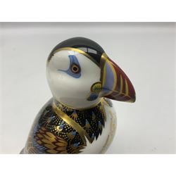 Three Royal Crown Derby paperweights, comprising Puffin with gold stopper and original box, Platypus with silver stopper and Penguin with missing stopper, all with printed marks beneath 