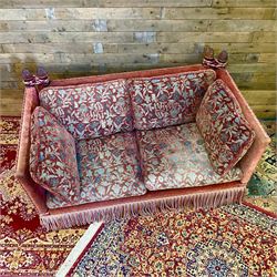 Knole type drop arm sofa with cushions in a traditional patterned upholstery,