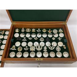 Great British Regiments, 1977, set of fifty two frosted silver medals by the Birmingham Mint, each bearing the name of a regiment with a depiction of an action on the obverse and further details on the reverse, all hallmarked Birmingham Mint, assay offices and dates; together with 52 base metal copy cap badges for each regiment, all housed and mounted on two trays and contained within a wooden presentation case, with brass plaque and fittings, lock and key, with a certificate of authenticity 