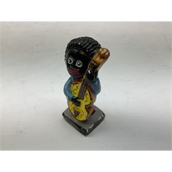 Robinson Jam plaster Golly band, including drummer and singer, H7.5cm

Originally handmade by mothers in Africa for their children from old fabric and cloth, the golly doll was adopted as the mascot and trademark for the Robertson's confectionery brand around 1910 after the company's founder John Robertson visited the US and noticed children playing with them. Robertson's Gollies have been collected by people across the UK and around the world for generations but garnered a contentious image in the 1980s because of links to racism. The trademark was removed from Robertson's branding in 2001.