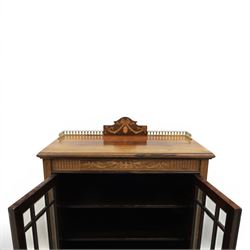 Druce & Co - Edwardian inlaid cabinet, galleried topwith inlay and brass galleried top, inlaid frieze above twin bevel glazed doors revealing a shelved interior, the lower section with fall front cupboard
