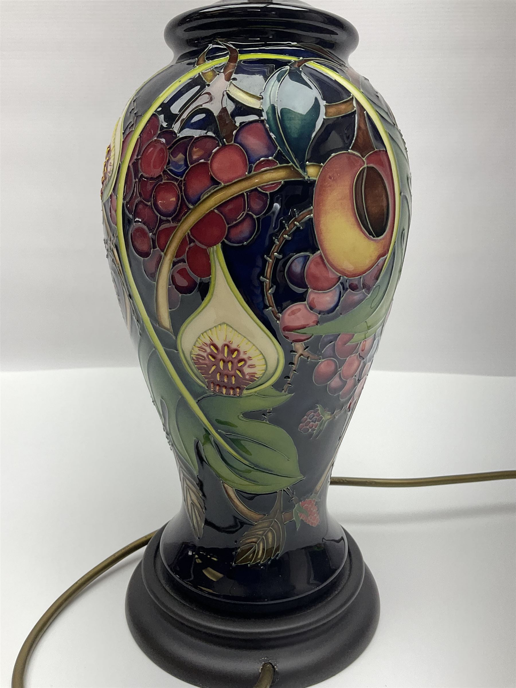 Moorcroft table lamp of baluster form, decorated in the Queens Choice pattern by Emma Bossons, H49cm