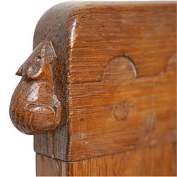 Mouseman - pair of 1930's adzed and panelled oak single beds, the head and foot-boards with arcade-carved cresting rails above adzed panels, with Vibase mattress supports, carved with mouse signature, by the workshop of Robert Thompson of Kilburn