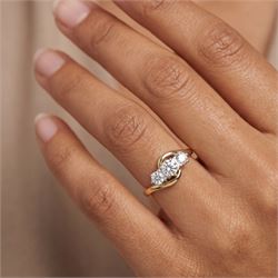 18ct gold diamond crossover ring, set with three round brilliant cut diamonds, hallmarked, total diamond weight 0.50 carat