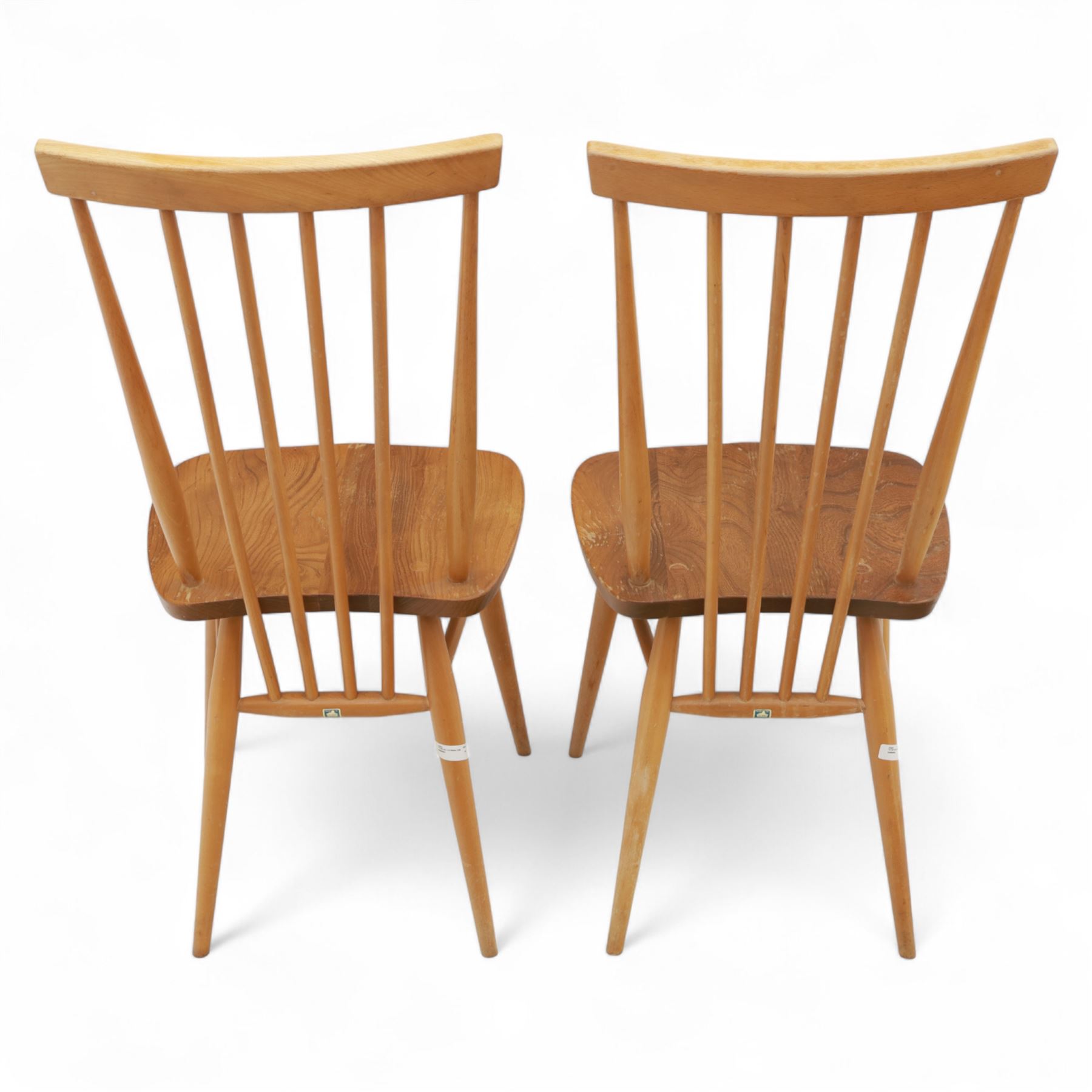 Ercol - Pair of high back Windsor kitchen chairs, elm seats with beech stick backs and legs, shaped saddle seats and turned stretchers