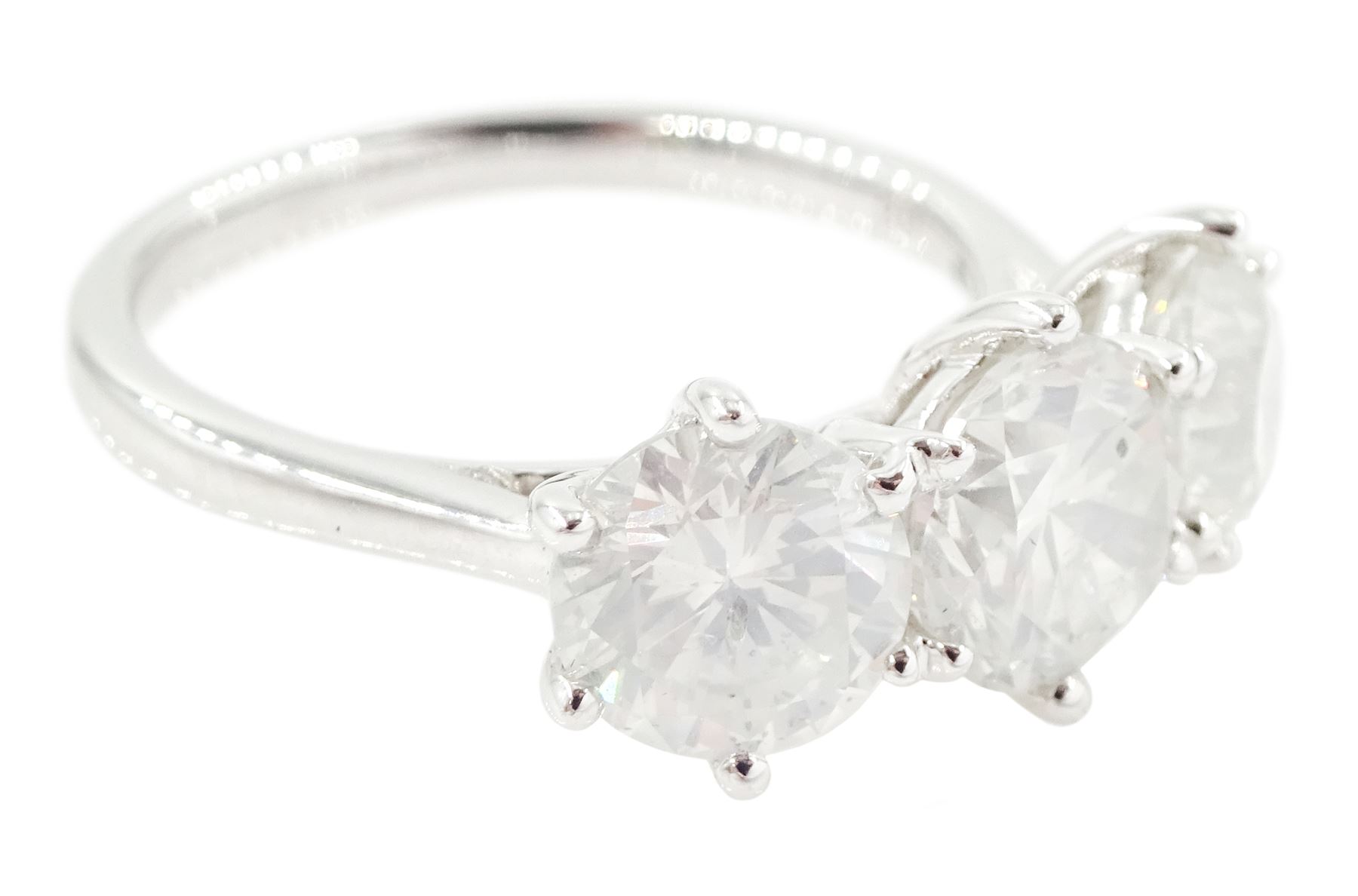 Platinum diamond ring, set with three round brilliant cut diamonds, hallmarked, total diamond weight approx 3.25 carat