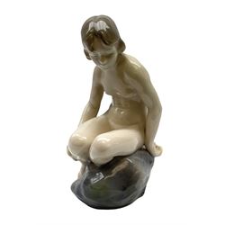 Royal Copenhagen 'Girl on Stone' figure modelled as a female nude seated upon a rock, designed by Ada Bonfils, model no. 4027, with printed and painted marks beneath, H14cm