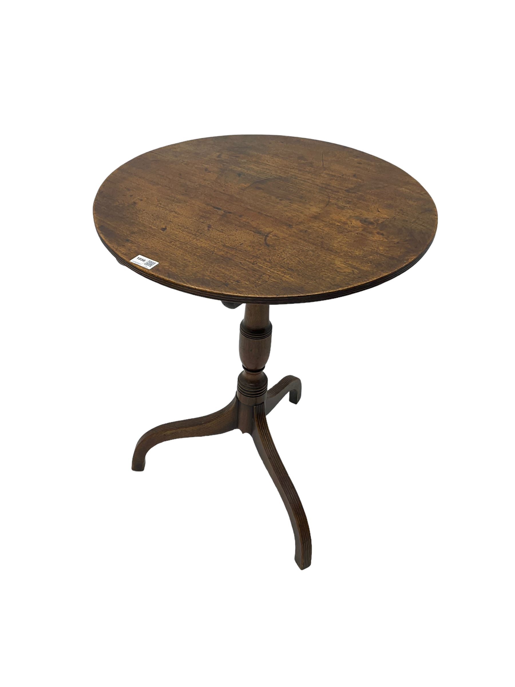 Early 19th century mahogany tilt-top pedestal table, the circular top with reeded edge, raised on turned support with reeded tripod base