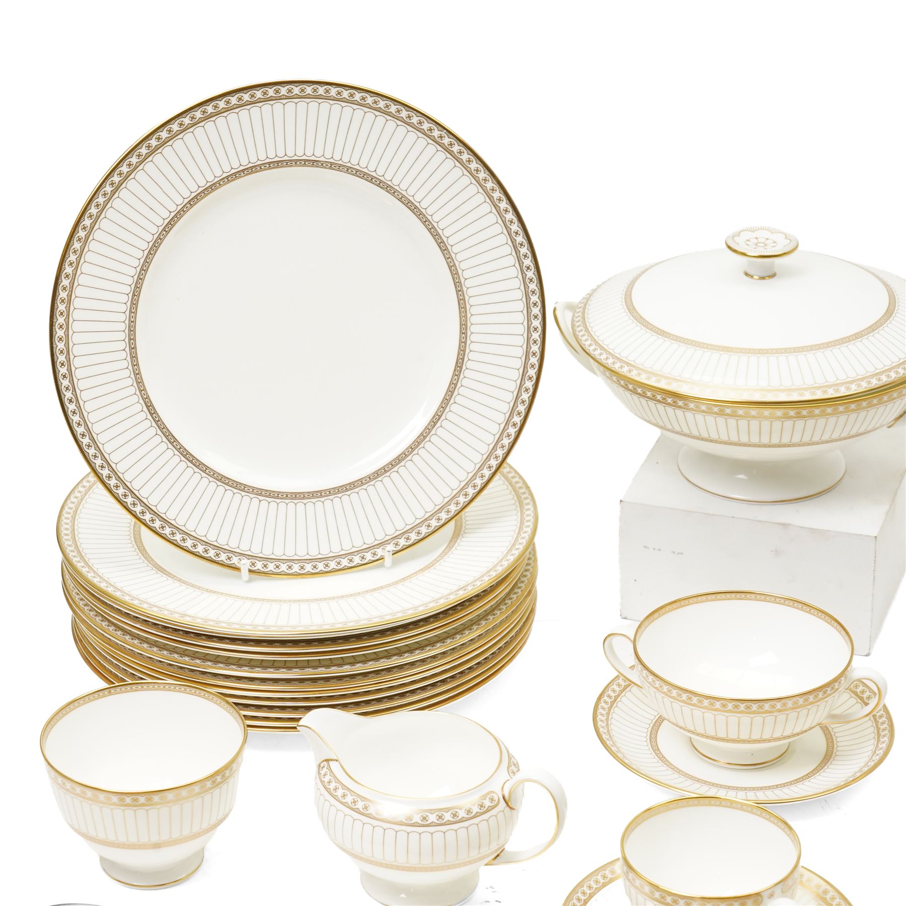 Wedgwood 'Colonnade' pattern dinner and tea service comprising twelve dinner plates, twelve dessert plates, nine soup bowls and stands, pair of covered vegetable dishes, sauce boat and stand, eight tea cups and saucers, thirteen tea plates, milk jug and sugar bowl