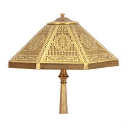 In the manner of Tiffany & Co, early 20th century gilt bronze Adam pattern table lamp, circa 1910, the circular spreading base decorated with flower heads and beaded bands, stiff leaves and husks, leading to a reeded column detailed with stiff leaves and swags, supporting a pierced octagonal shade, with original fittings, stamped beneath Tiffany Studios New York 539, overall H44.5cm


