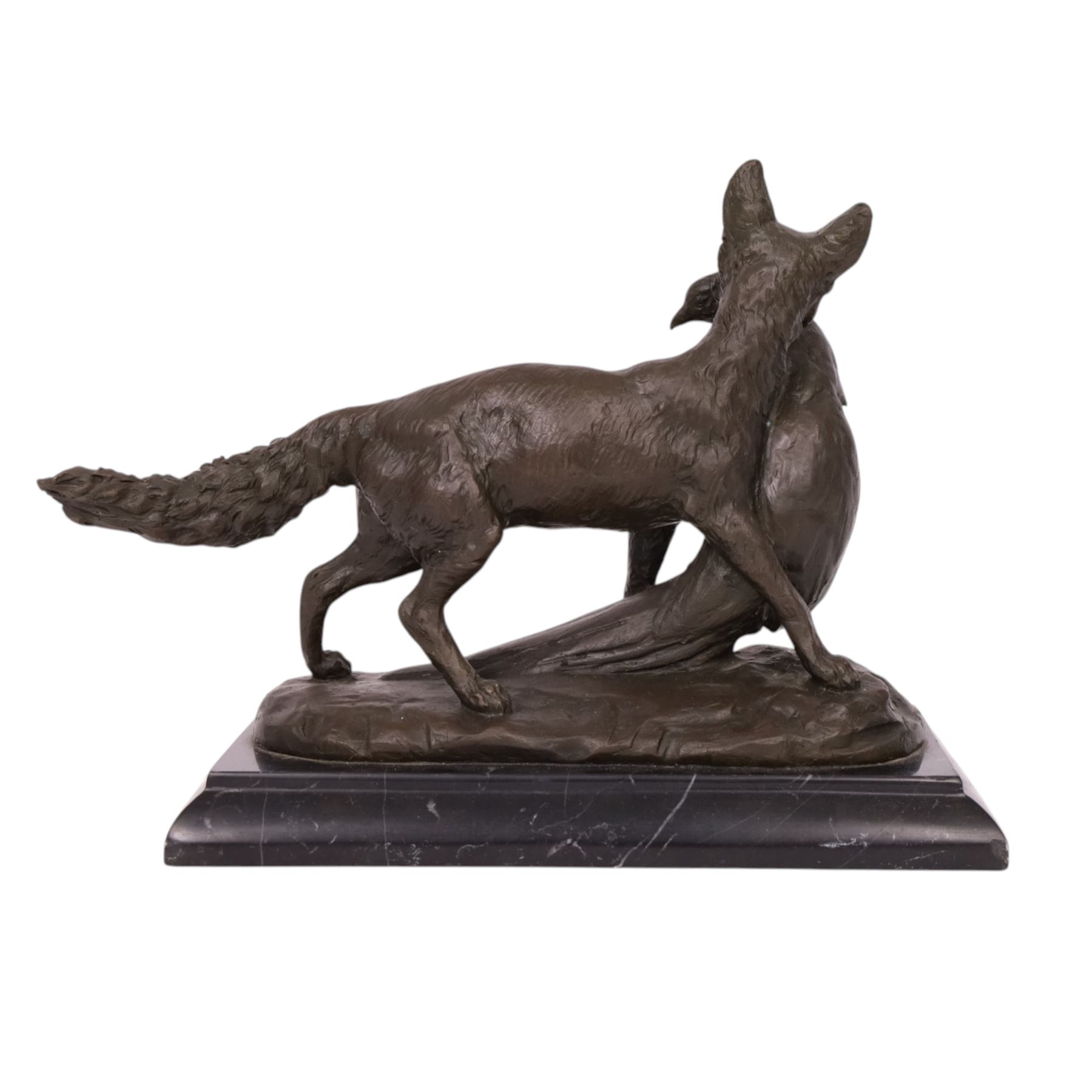 Composite figure of a fox with a pheasant in his mouth, upon a stepped marble base, H23cm, L28cm