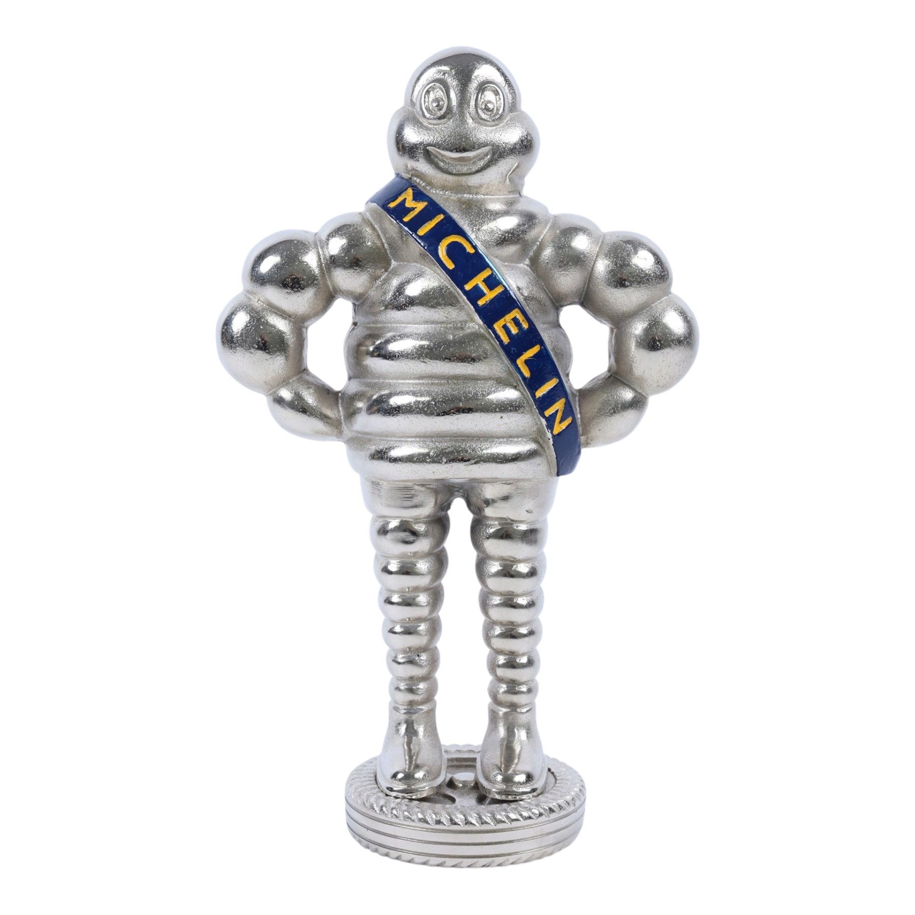 Metal hollow-cast figure, modelled as a Michelin Man stood upon a tire, H26.5cm