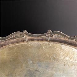 Edwardian silver twin handled tray, of navette form with C scroll decoration to the outer rim, hallmarked Goldsmiths & Silversmiths Ltd, London 1907, handle W61cm