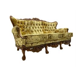 Large French design stained beech three seat settee, carved and pierced cresting rail with cartouche and scrolling foliate decoration, scrolled arms, upholstered in crushed gold velvet, the apron heavily carved with floral cartouche motifs, raised on ball and claw feet