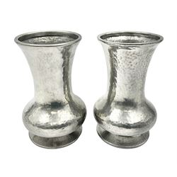 Pair of Liberty & Co Tudric pewter vases, each of bellied form with hammered finish, upon a circular spreading foot, impressed beneath 0987, H12cm