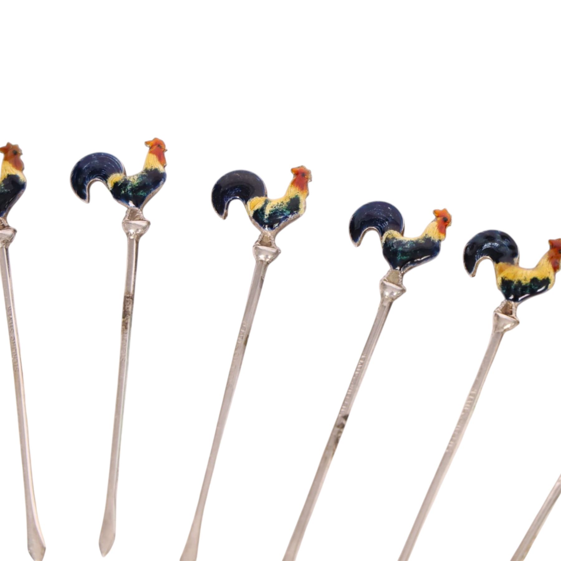 Set of six early 20th century silver cocktail sticks with enamel cockerel finials, stamped Sterling Silver