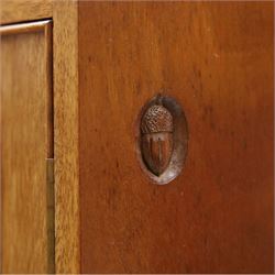 Acornman - mahogany sideboard, rectangular top over four drawers and four panelled cupboard doors with brass handles, on bracket feet, with signature carved acorn, by the workshop of Alan Grainger of Brandsby