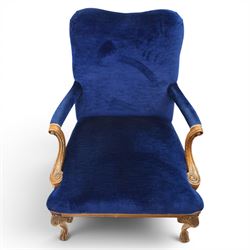 Pair of George II design Gainsborough armchairs in deep blue upholstery, shaped back over scrolled and carved arms, with cabriole supports and carved shell knees terminating in claw on ball feet
