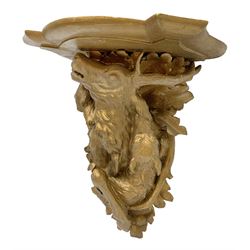 Early to mid 20th century gilt carved oak wall bracket, the shaped top with carved support in the form of a stag and two hounds amidst oak leaves, H40cm