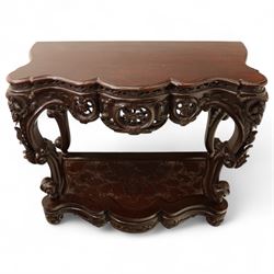 Chinese stained hardwood side table, late Qing dynasty style, with shaped top above a pierced and carved frieze of foliage and fruiting vines, cabriole legs terminating in scroll feet, united by a carved shaped undertier