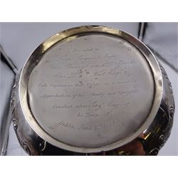 George III Irish silver teapot, of squat circular form, the body with repousse and chased floral and C scroll decoration, with capped C handle and ivory insulators, engraved to base 'Presented to Troop Sergeant Major John Percival, of the 4th Dragoon Guards by Alex D. Tait, Esq, late Captain in that corps as a mark of approbation of his steady and upright conduct when Sergeant Major of his Troop, Dublin, June 2nd 1843', hallmarked William Law, Dublin 1817, H12.5cm, This item has been registered for sale under Section 10 of the APHA Ivory Act