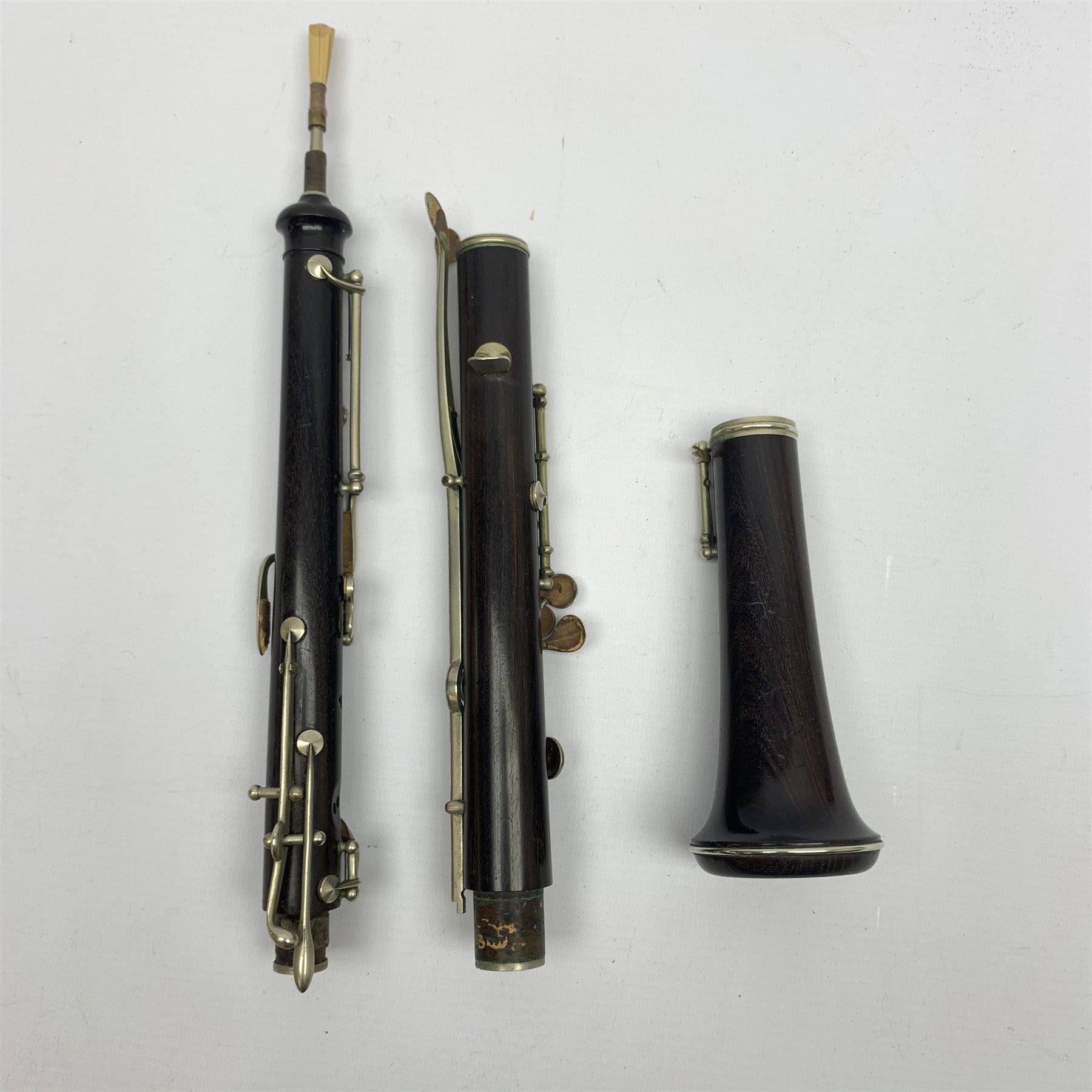Rosewood threepiece oboe with nickel mounts, unmarked, cased Musical