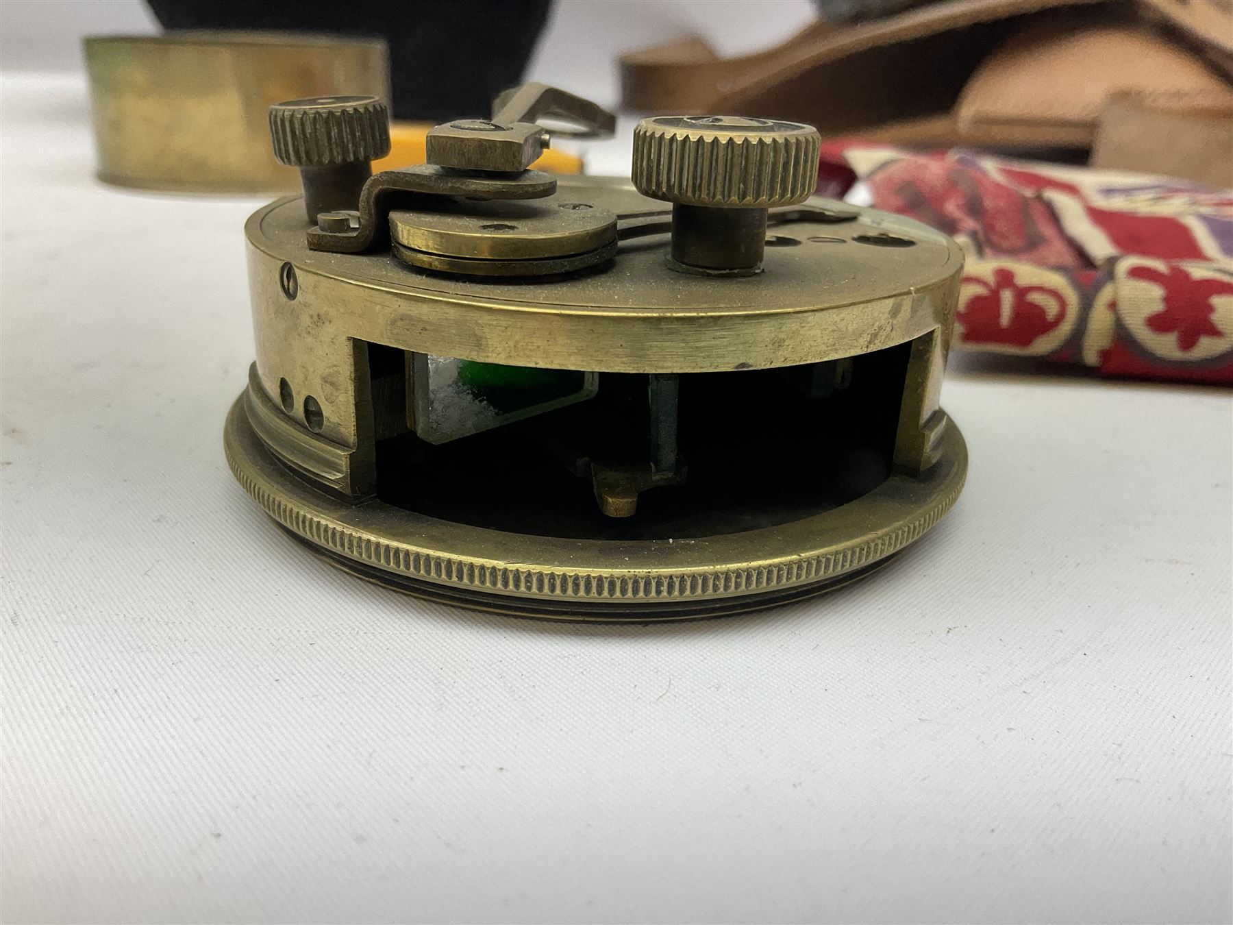 George VI 1937 Coronation flag, the central portrait and date covered with stitched panels 56 x 83cm; sailor's hat; leather holster with belt dated 1943 containing Lone Star toy die-cast Luger gun; and reproduction Stanley brass cased pocket sextant (4)