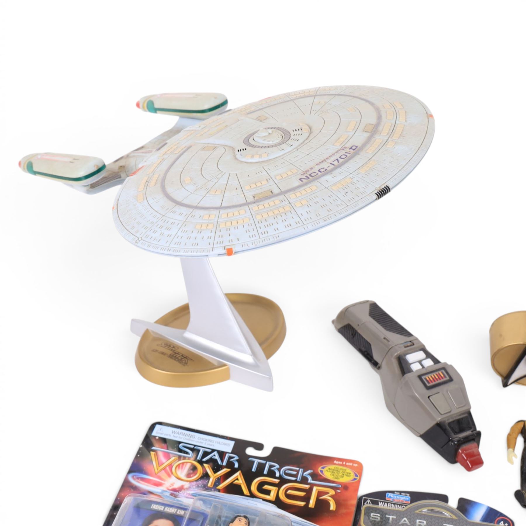 Four carded Playmates Star Trek figures, comprising Ensign Harry Kim, Galaxy Collection Kirk, Original Spock and Spock, together with a small collection of loose Star Trek models and star ships