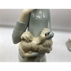Lladro 'Walk With the Dog' figure no. 4893, together with Lladro swan figure, Porceval figure of a gentleman with a bird perched upon his hand and a further of a lady with flowers beside a basket, all with marks beneath, tallest H40cm