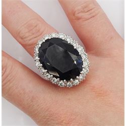 18ct white gold large oval sapphire and round brilliant cut diamond cluster ring, sapphire approx 27.35 carat, total diamond weight approx 1.00 carat