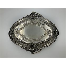 Edwardian silver swing handled basket, of navette form, with four repousse lion masks to each corner and with pierced and embossed floral, scroll and shell decoration to sides, base and handle, hallmarked Charles Horner, Birmingham 1906, height including handle H20cm