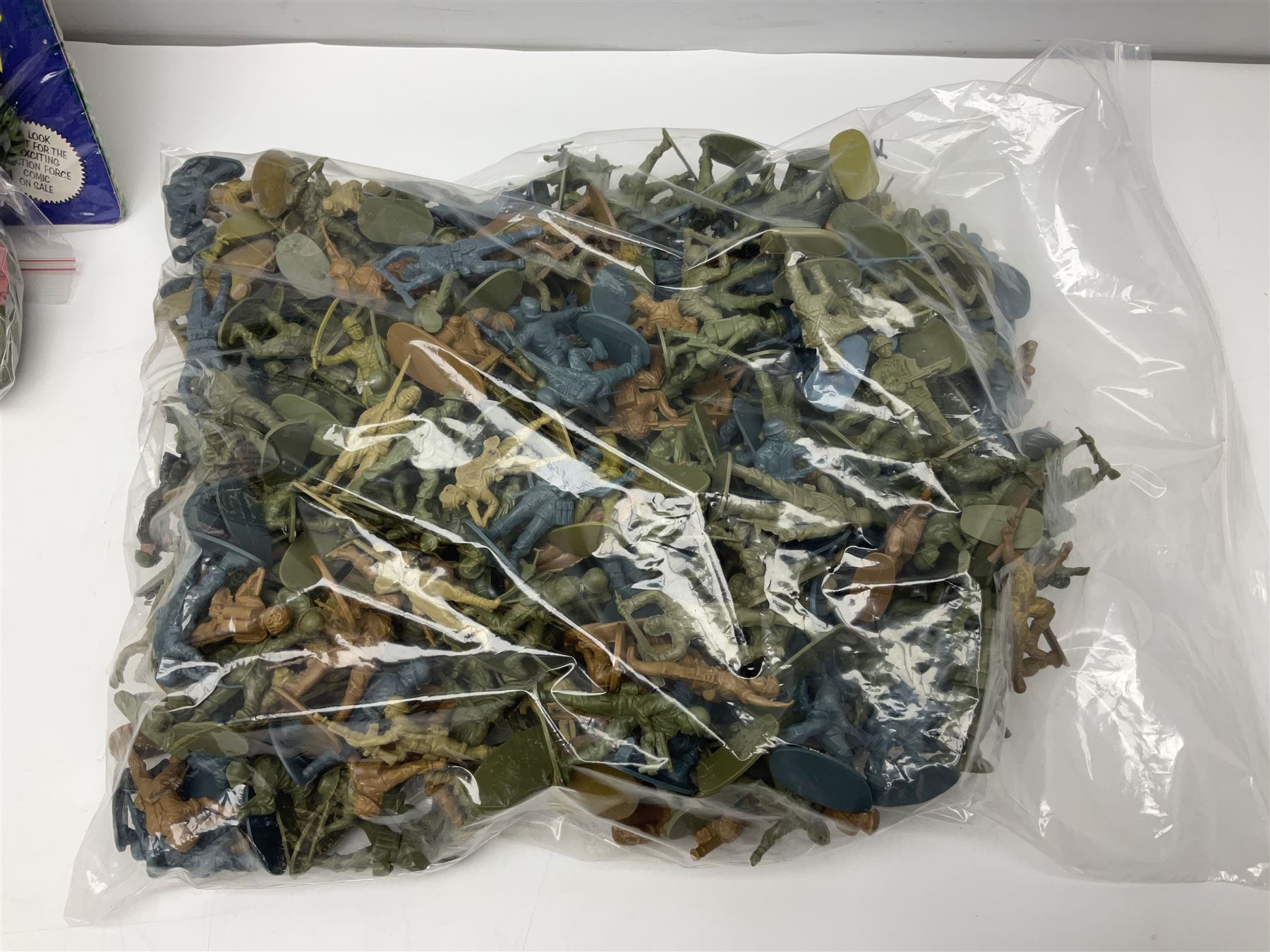 Ten 1980s Action Man Action Force figures with six original card backs; over three-hundred and forty Airfix large scale plastic soldiers; over two-hundred and thirty small scale plastic soldiers; together with accessories including boats, ladder etc