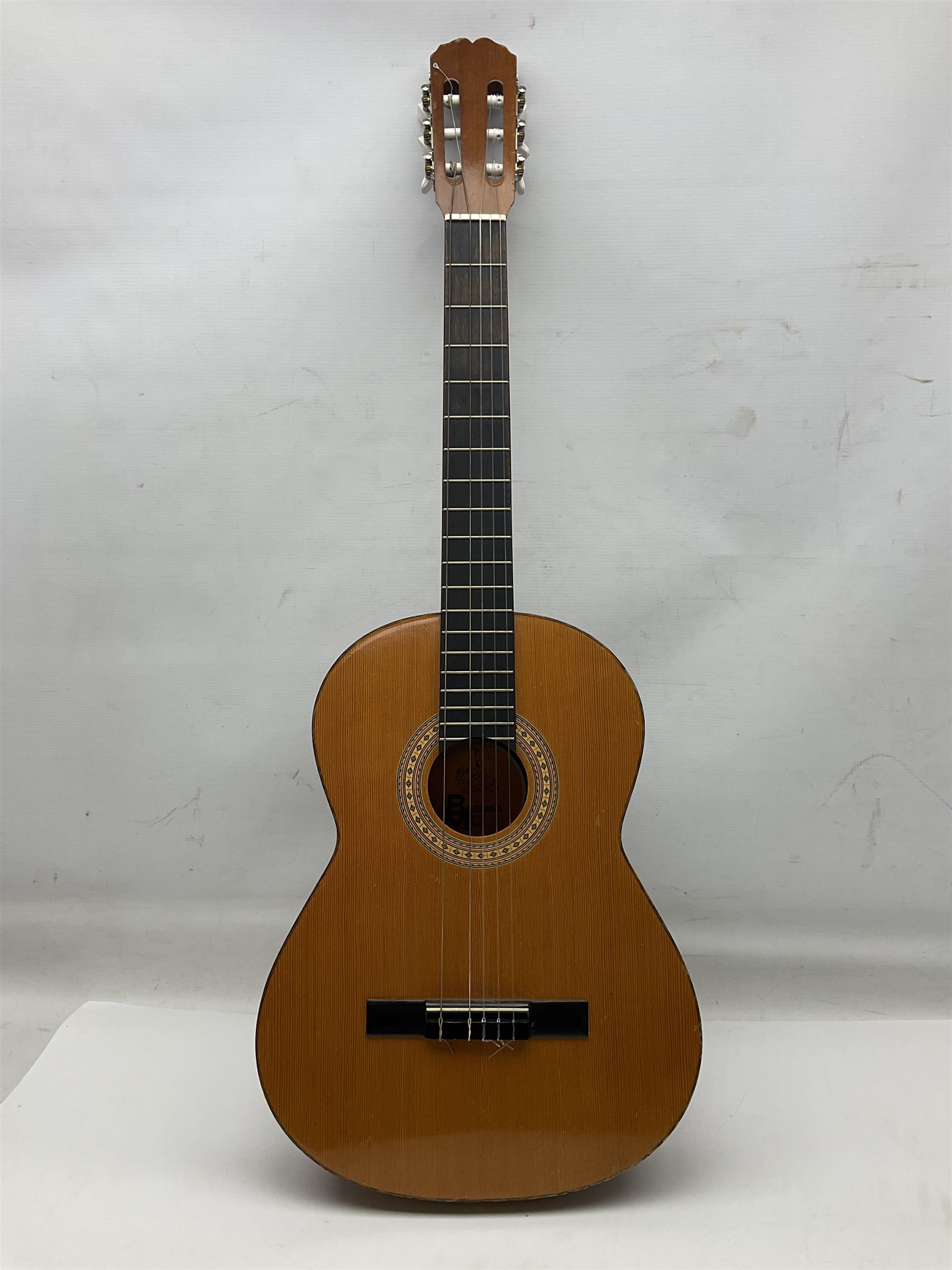 Spanish BM acoustic guitar with mahogany back and sides and spruce top L101cm; in cello carrying case; Roland foot pedal and two Yamaha foot pedals; tin D# organ pipe; folding music stand etc