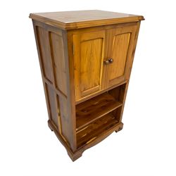 Unicornman - yew wood cabinet, moulded hinged lid over two panelled doors and shelves (W56cm, H99cm, D45cm); and four Unicorn man CD racks two in yew wood and two in oak (W20cm, H36cm, D20cm); all carved with unicorn signature and by Geoff Gell, Coxwold
