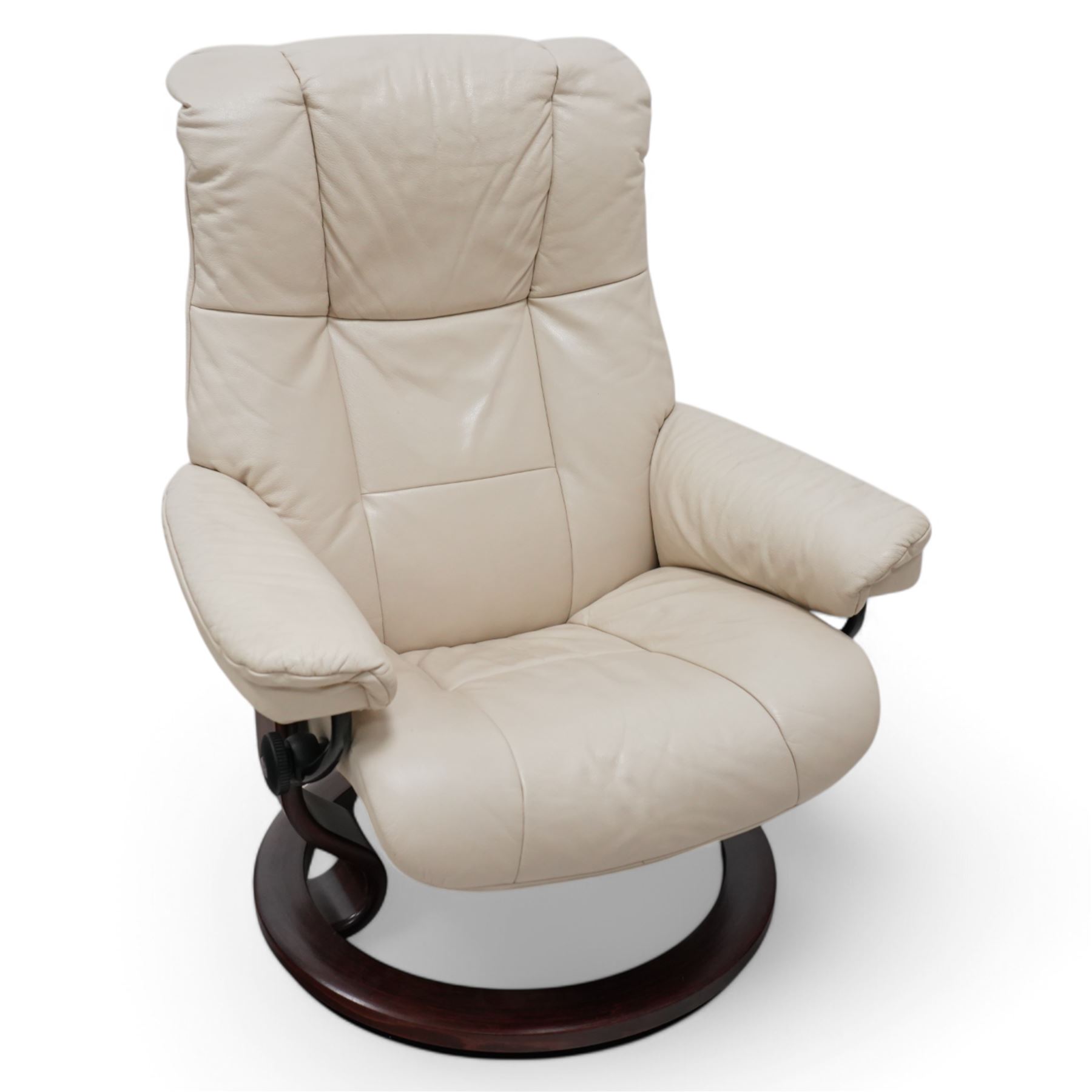 Ekornes - Stressless chair with stool, with padded arms and high backrest, raised on a circular mahogany-stained swivel base, fitted with reclining tension adjustment handle, supplied with stool with a lighter wood base 