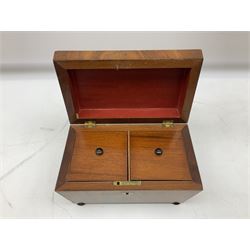 Mid 19th century mahogany tea caddy of sarcophagus form, the hinged lid opening to reveal twin lidded divided interior, raised upon four compressed bun feet, H14.5cm W22.5cm D13cm