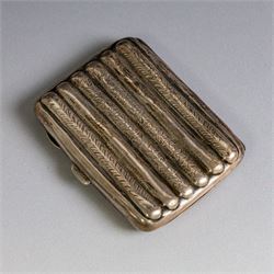Two early 20th century silver cigarette cases, comprising a rectangular example with foliate decoration and vacant shield cartouche and a 1920s example with engine turned decoration and engraved initials, both hallmarked
