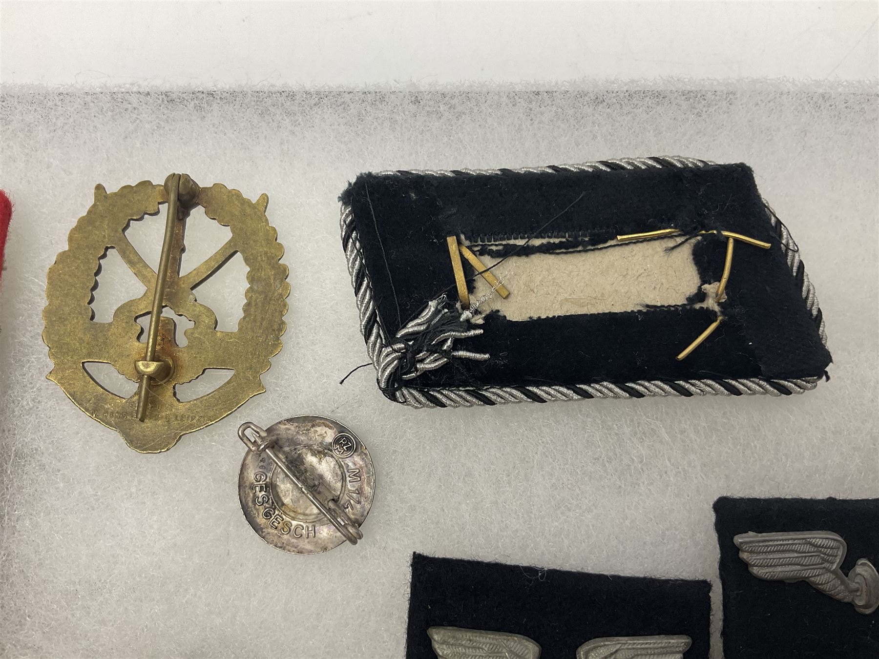 WW2 German Don Cossack epaulettes; and quantity of German insignia including SA Sports Badge for war wounded, Hitler Youth badge, Young Cossacks badge, Wound badge, Hitler Youth cuff title etc; in glass topped display box.