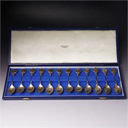 'The Twelve Roman Spoons' a set of twelve silver spoons each with the head of a Deity in f...