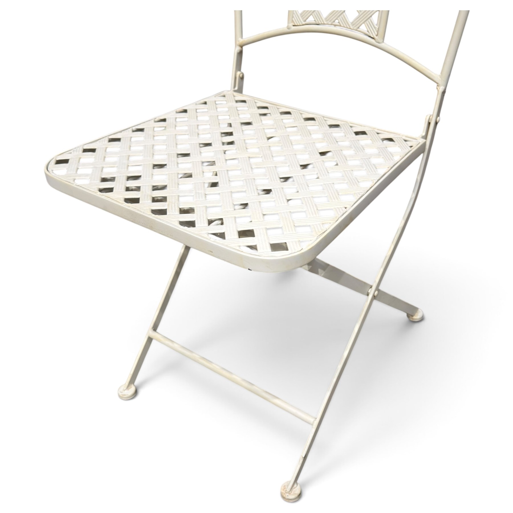 Pair of Victorian design wrought metal folding garden chairs, scrolled cresting rail over pierced foliate medallion, lattice back and seat on X-frame folding base