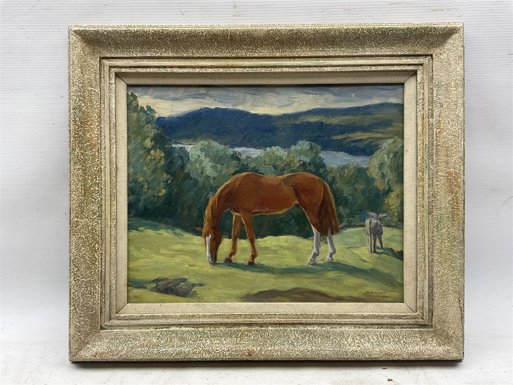 M Garnett (British 20th Century): Grazing Horses ''Ptarmigan' At Grass', oil on canvas signed and dated 1946, titled verso 29cm x 37cm 