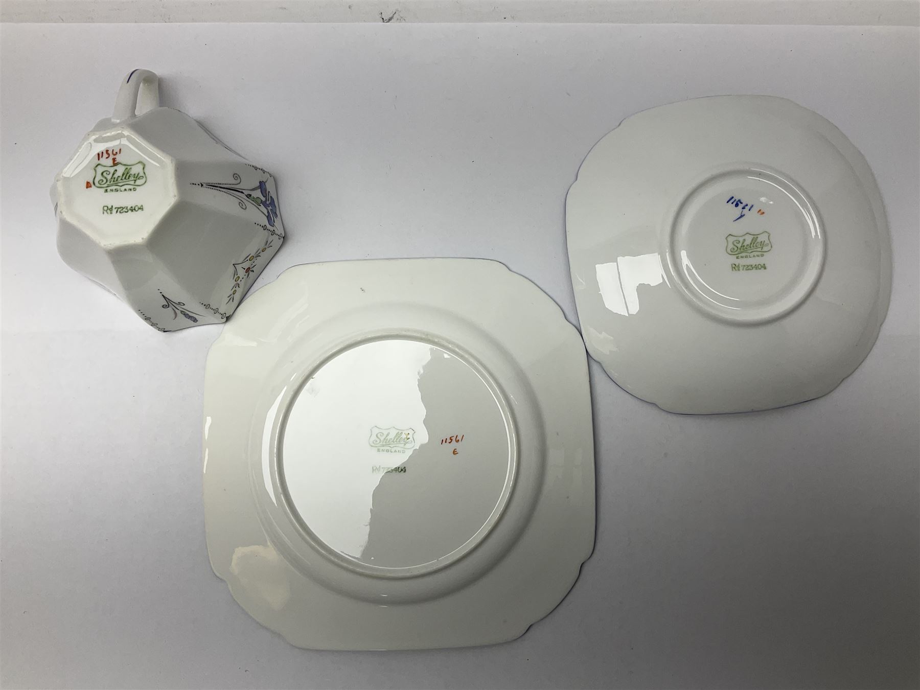 1920s Shelley Queen Anne shaped trio, decorated in the Blue Iris pattern no. 11561, ith printed mark beneath 